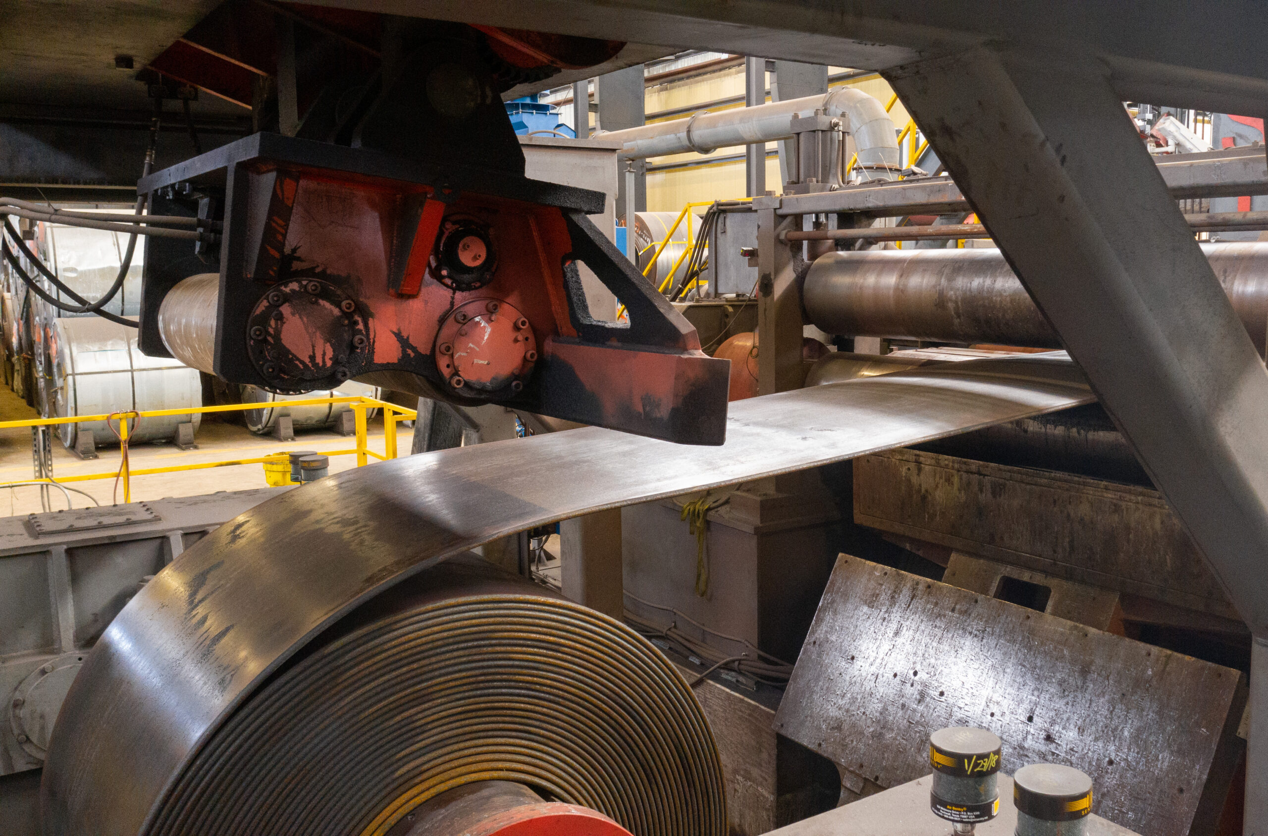 Coil fed onto a cut to length line to become sheet or plate